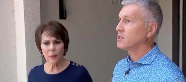 Woman and man outside a home speaking on camera.